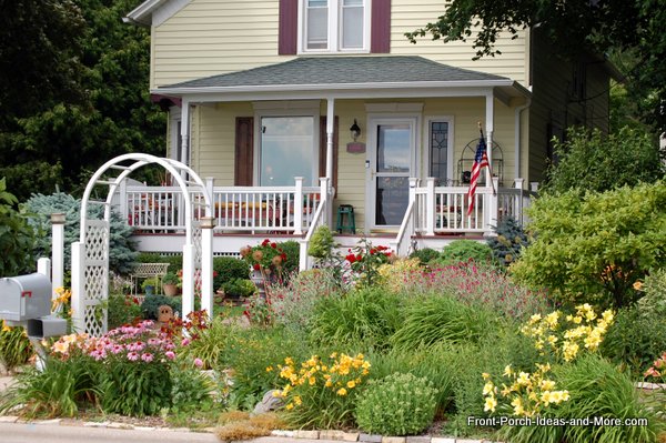 beautiful gardens in front yard pretty yellow home with flower garden in front of porch - Flower Garden Ideas For Front Yard beautiful gardens in front yard pretty yellow home with flower garden in front of porch - Flower Garden Ideas For Front Yard